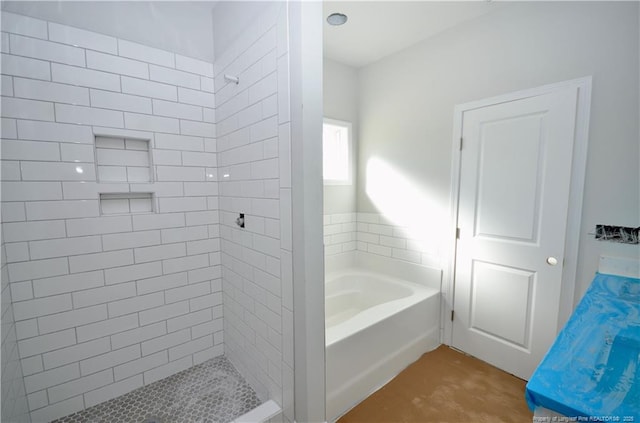 bathroom with shower with separate bathtub