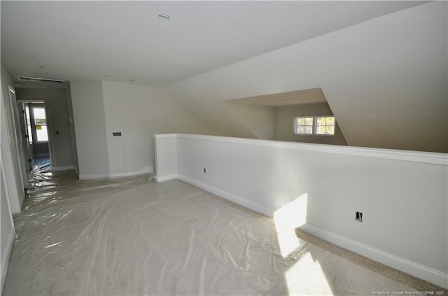 bonus room featuring vaulted ceiling