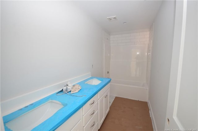 bathroom featuring vanity and shower / bath combination