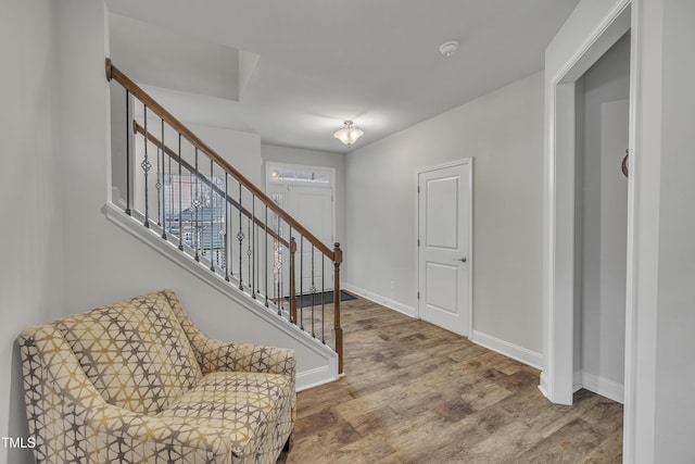 foyer entrance with hardwood / wood-style floors