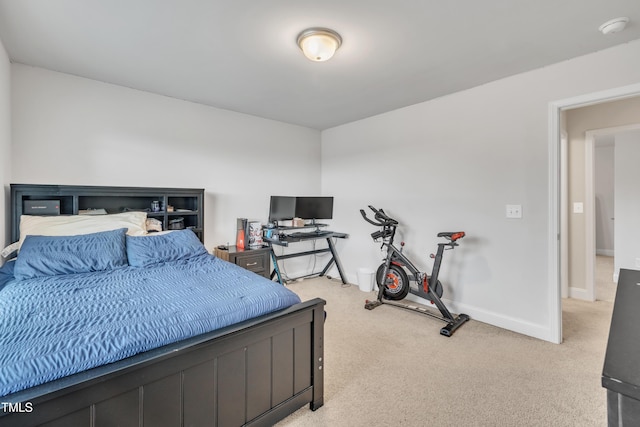 bedroom with light colored carpet