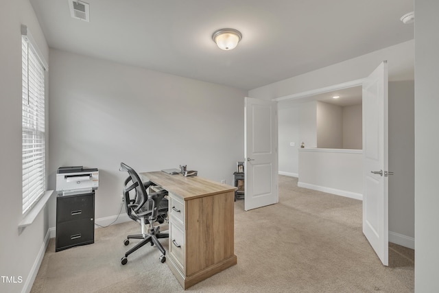 office featuring a healthy amount of sunlight and carpet floors