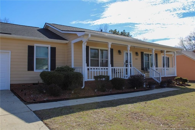 ranch-style house with a garage, a front yard, and a porch