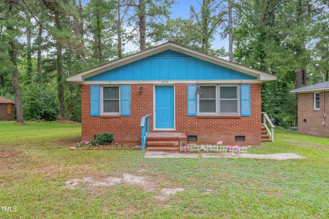 bungalow with a front yard