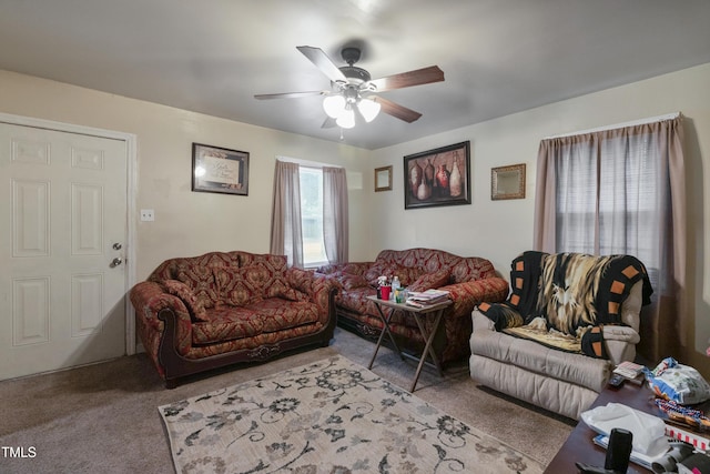 carpeted living room featuring ceiling fan