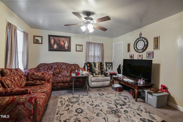 living room featuring ceiling fan and light colored carpet