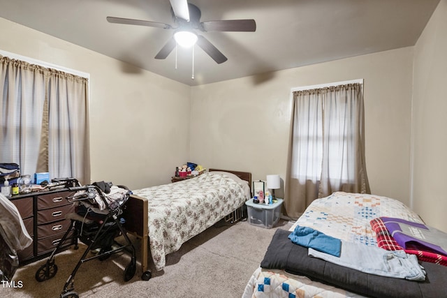 bedroom with ceiling fan and carpet floors