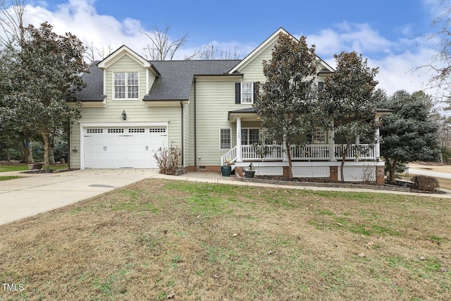 view of front facade with a front lawn, a porch, and a garage