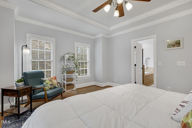 bedroom featuring hardwood / wood-style floors, connected bathroom, ceiling fan, and crown molding