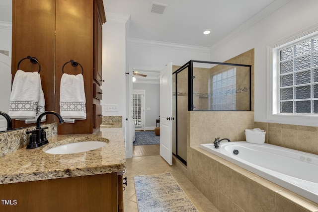 bathroom with ceiling fan, tile patterned flooring, shower with separate bathtub, vanity, and ornamental molding