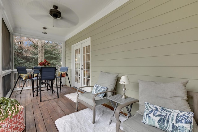 deck featuring ceiling fan and french doors