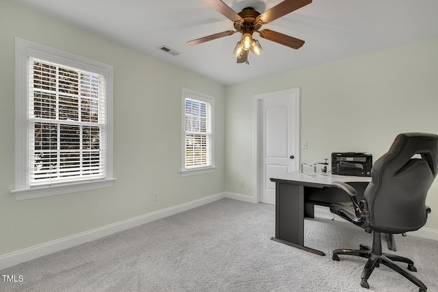 office area with light carpet and ceiling fan