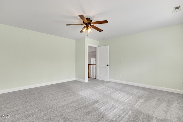 unfurnished room with ceiling fan and carpet floors