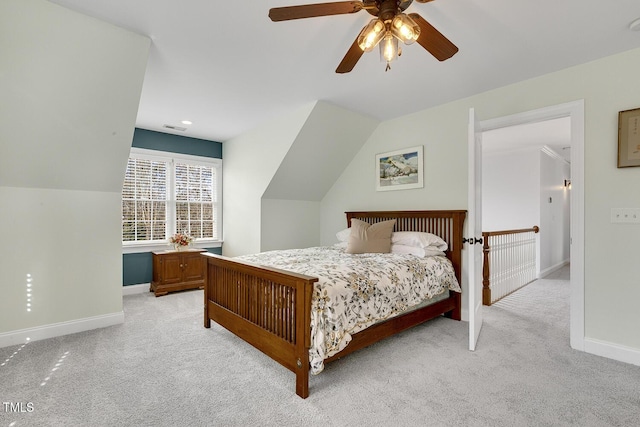 carpeted bedroom with ceiling fan and lofted ceiling