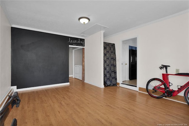 interior space with hardwood / wood-style floors and ornamental molding