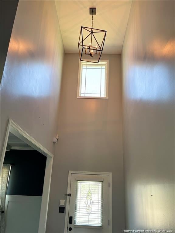 entryway with an inviting chandelier