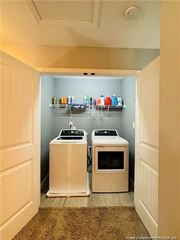 laundry room with independent washer and dryer