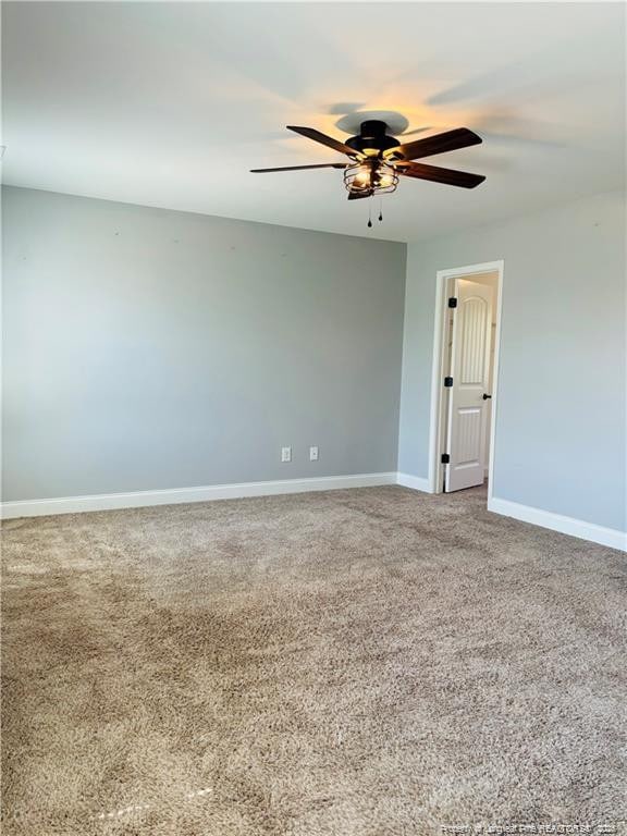 empty room with carpet and ceiling fan