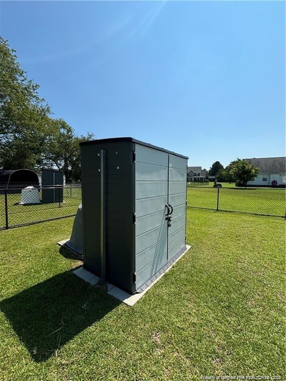 view of outbuilding featuring a yard