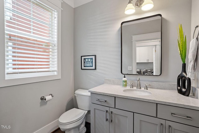 bathroom featuring toilet and vanity