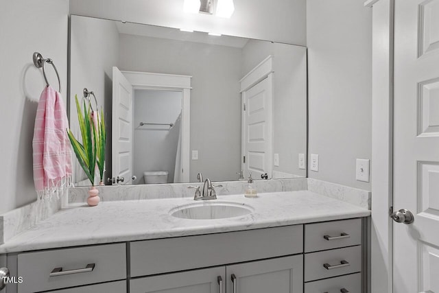 bathroom with toilet and vanity