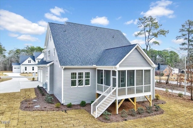 back of property featuring a sunroom