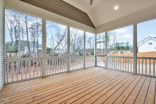 unfurnished sunroom featuring lofted ceiling