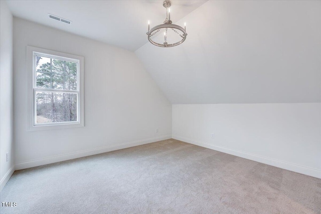 bonus room featuring light carpet and lofted ceiling