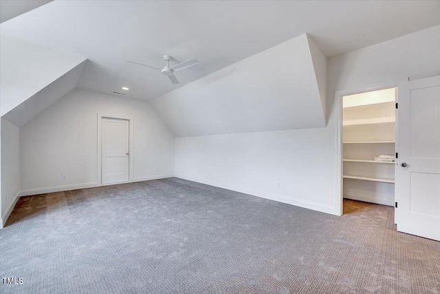 bonus room with ceiling fan, carpet, and vaulted ceiling