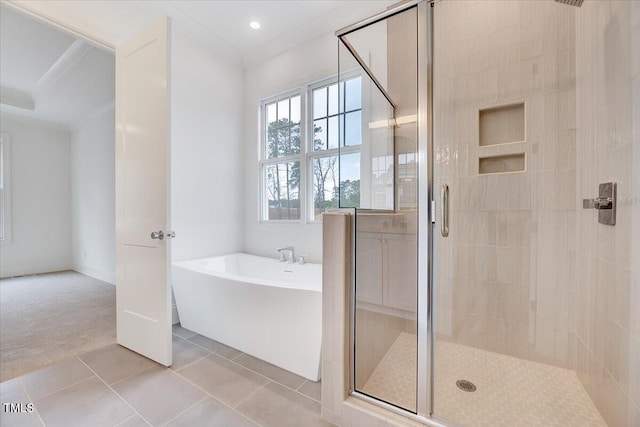 bathroom featuring separate shower and tub and tile patterned floors