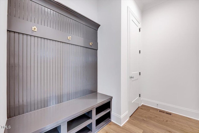 mudroom with light hardwood / wood-style floors