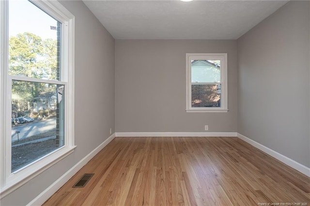 5193 Southport Dr, Fayetteville, NC 28311 - empty room with light hardwood / wood-style flooring and a healthy amount of sunlight