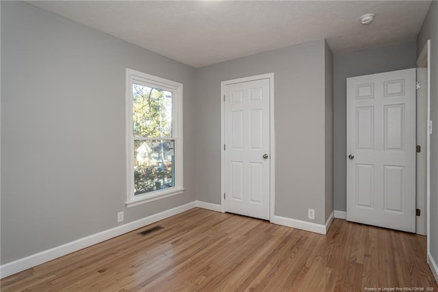 5193 Southport Dr, Fayetteville, NC 28311 - unfurnished bedroom with light wood-type flooring and a closet