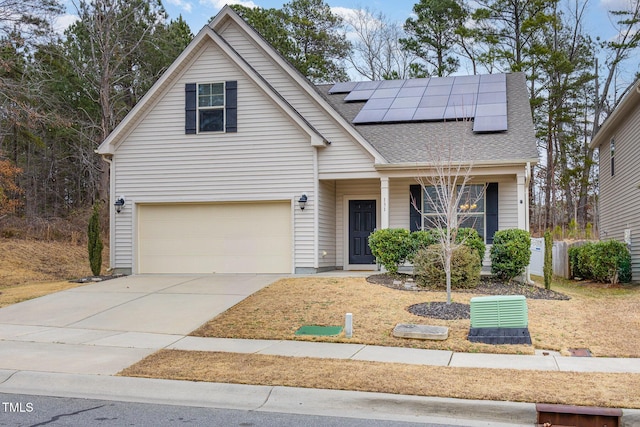 front facade featuring a garage and solar panels