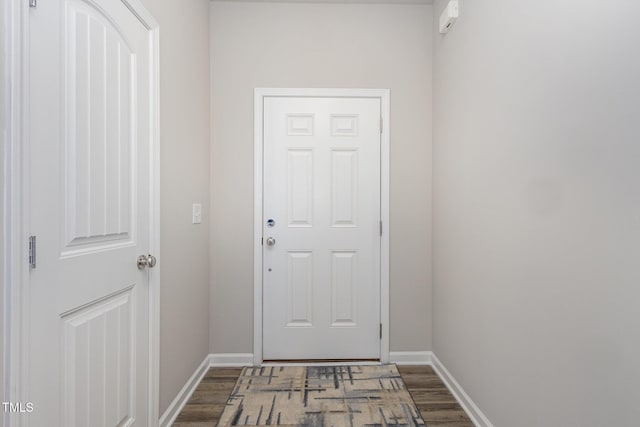 entryway with dark hardwood / wood-style floors