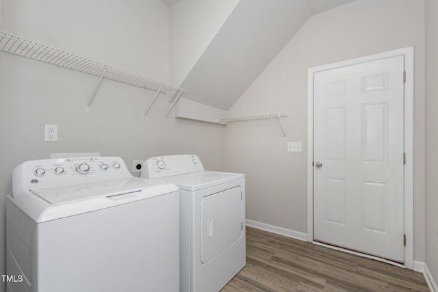 laundry area with hardwood / wood-style flooring and washer and clothes dryer