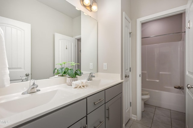 full bathroom featuring vanity, toilet, bathing tub / shower combination, and tile patterned flooring