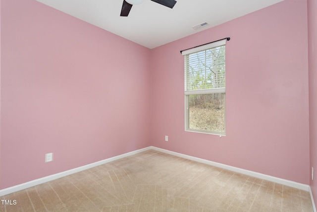 empty room featuring ceiling fan and carpet flooring