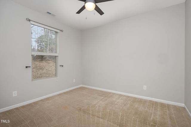 carpeted empty room with ceiling fan