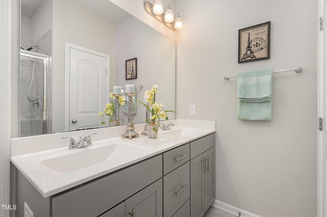 bathroom with walk in shower and vanity