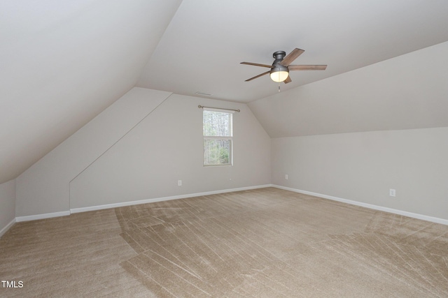 bonus room with light carpet, lofted ceiling, and ceiling fan