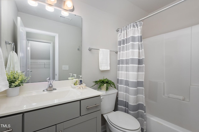 full bathroom featuring vanity, shower / bath combination with curtain, and toilet