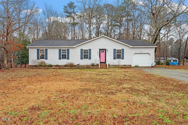 single story home featuring a front yard and a garage