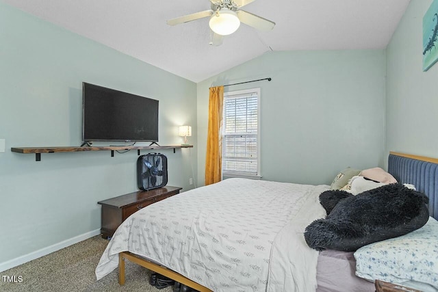 carpeted bedroom with vaulted ceiling and ceiling fan