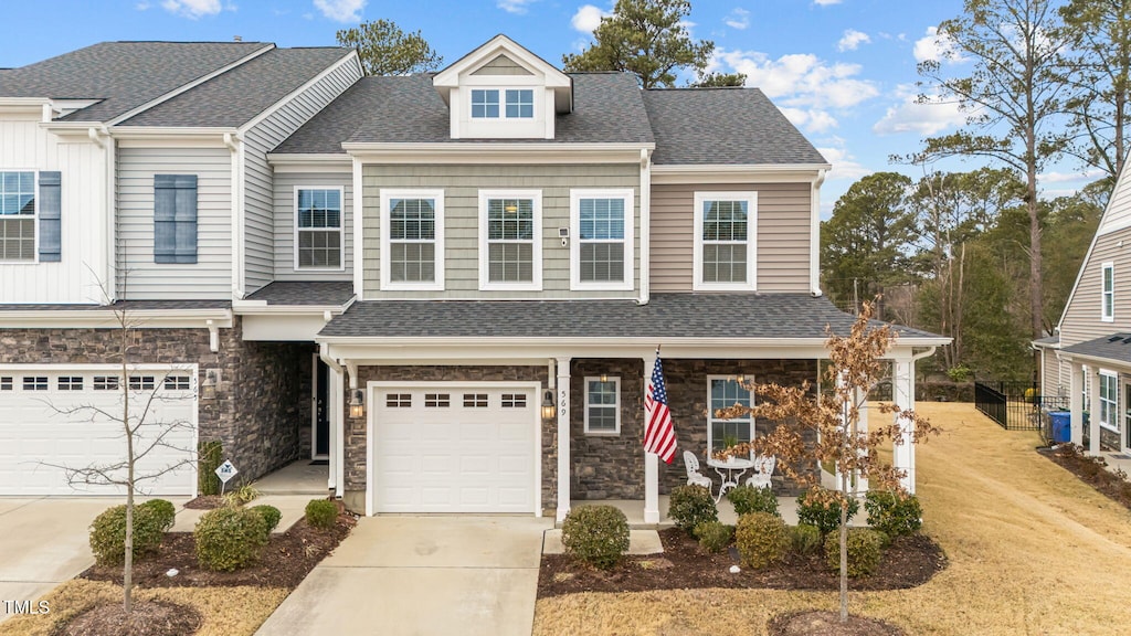 townhome / multi-family property featuring a garage