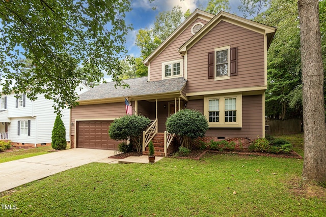 front of property featuring a front yard and a garage