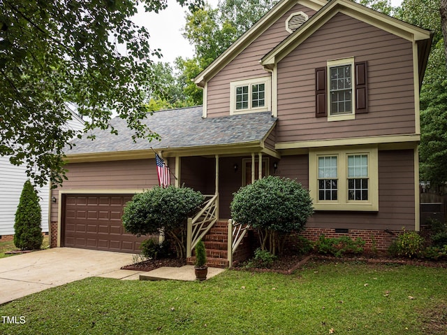 front of property featuring a front lawn, a porch, and a garage