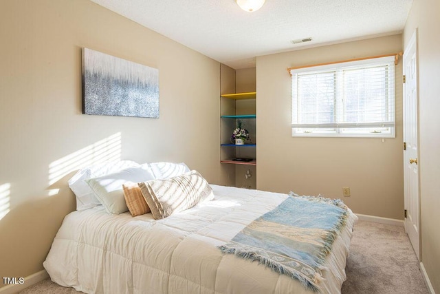 bedroom with light colored carpet