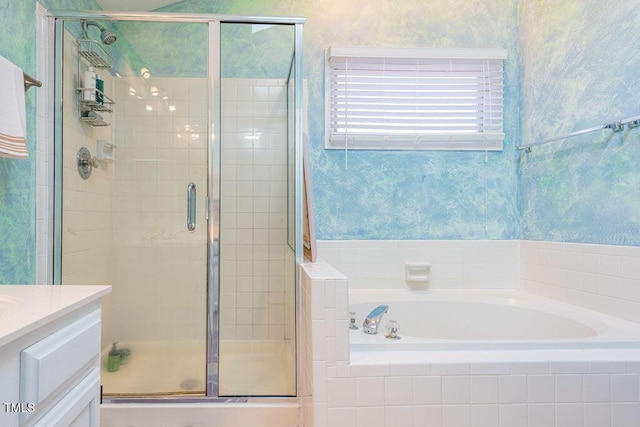 bathroom featuring vanity and shower with separate bathtub