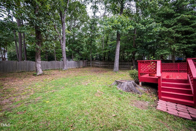 view of yard with a wooden deck